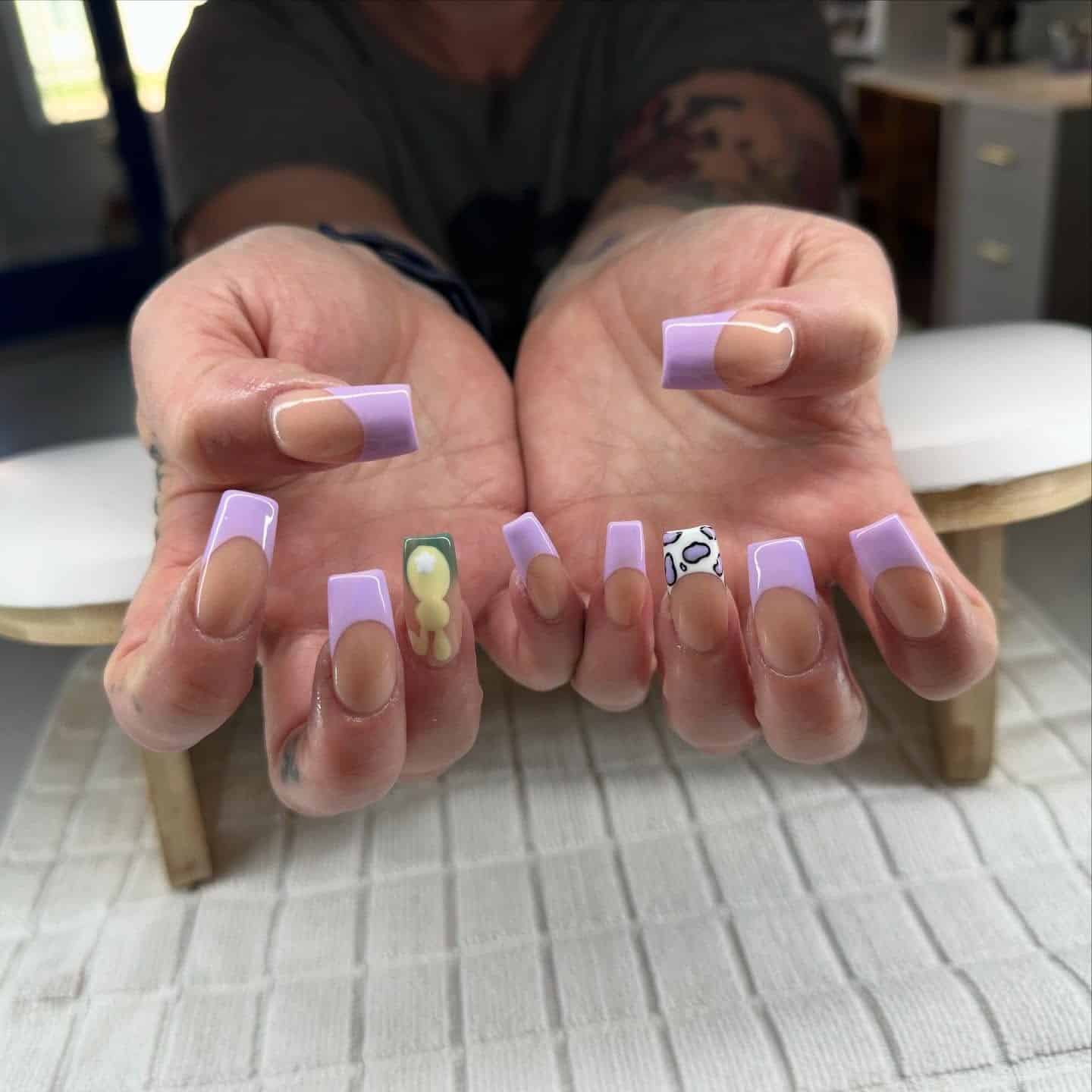 3. Playful Purple French Tips with Accent Art - purple french tip nail ideas