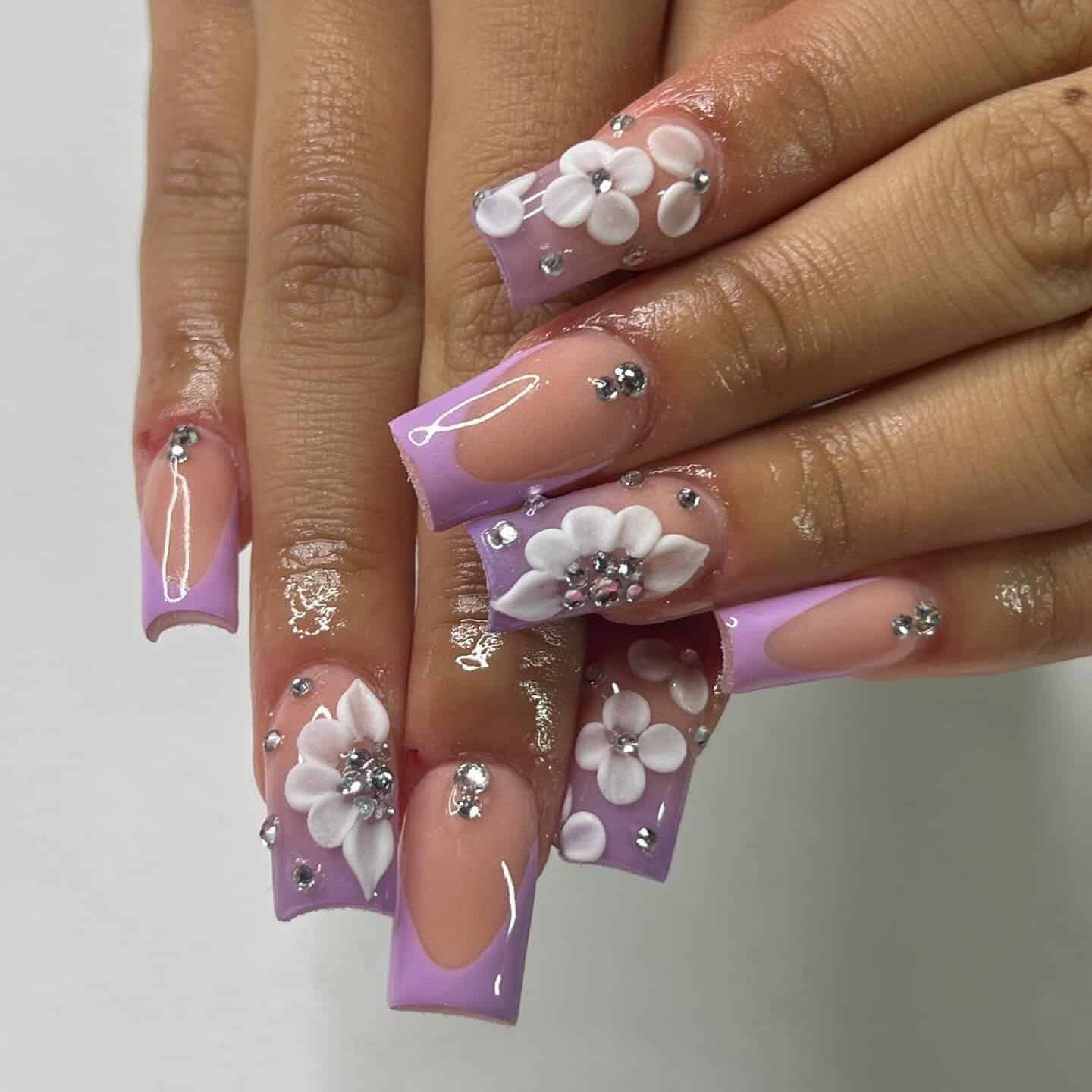 9. Sculpted Floral Purple French Tips - purple french tip nail ideas