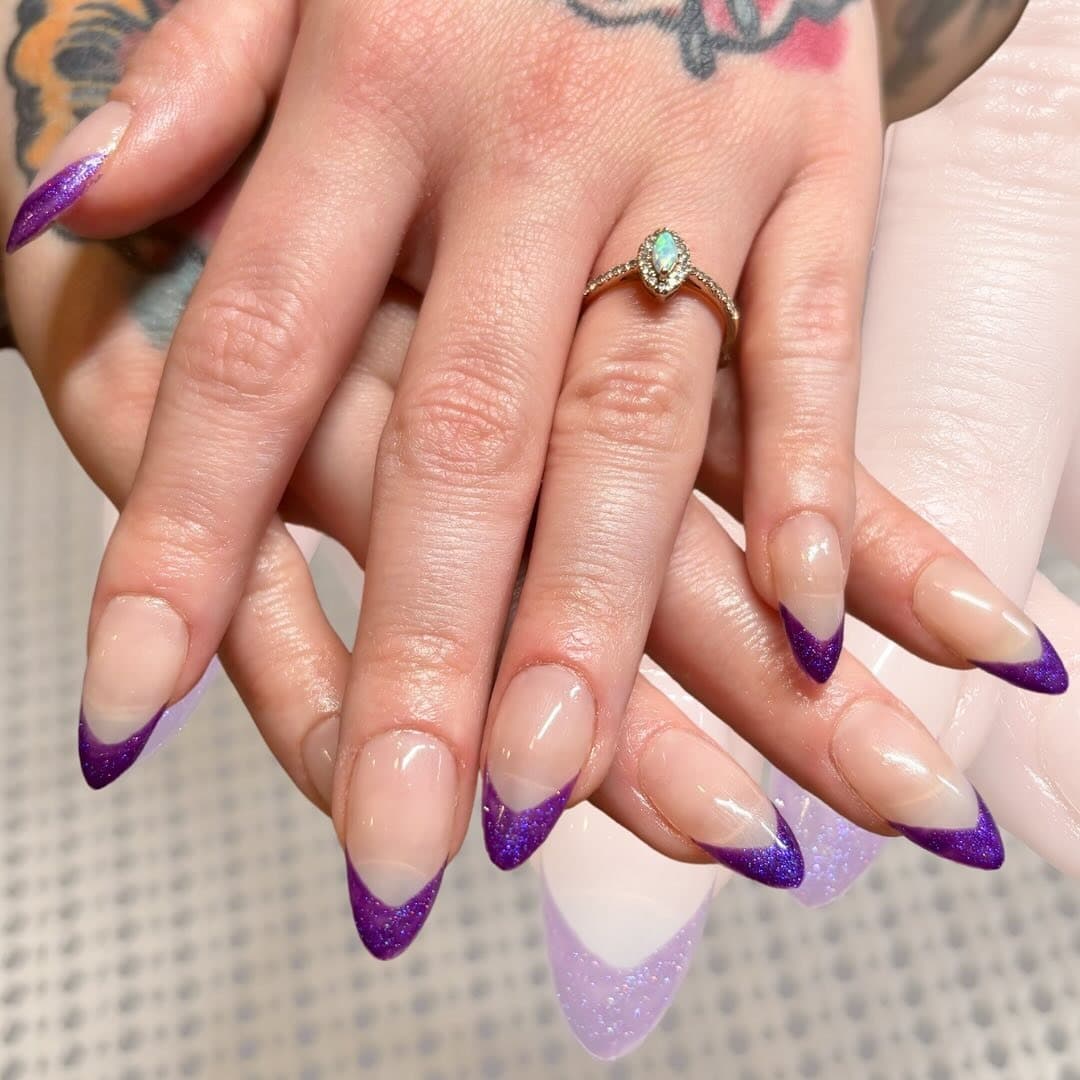 15. Glittered Purple V-French Almond Nails - purple french tip nail ideas