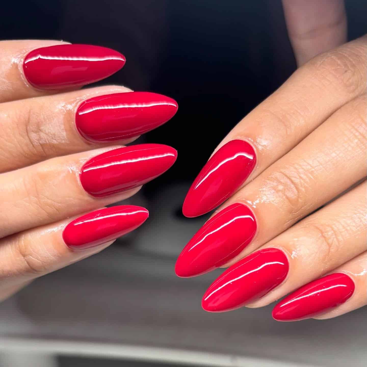 7. Garnet Almond Luxe Finish - red almond nail ideas