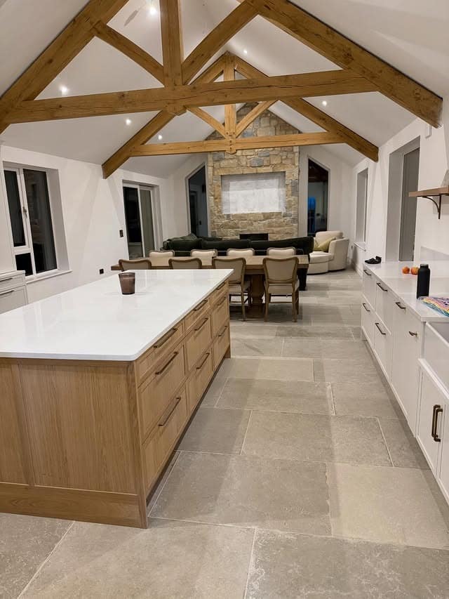 9. Grand Open Living and Kitchen with Stone, Oak, and Neutral Layers - living room and kitchen ideas