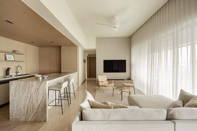 10. Refined Modern Living and Kitchen in Beige Stone and Soft White - living room and kitchen ideas