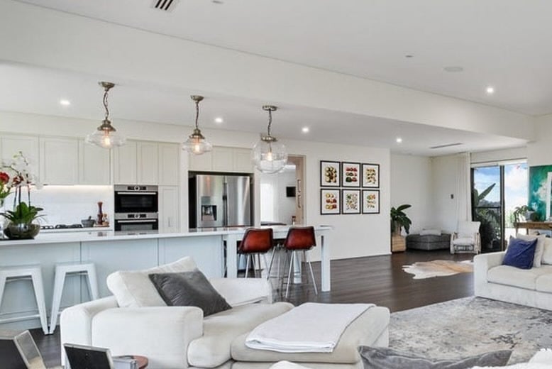 15. Bright Coastal-Inspired Living and Kitchen in White and Warm Wood - living room and kitchen ideas