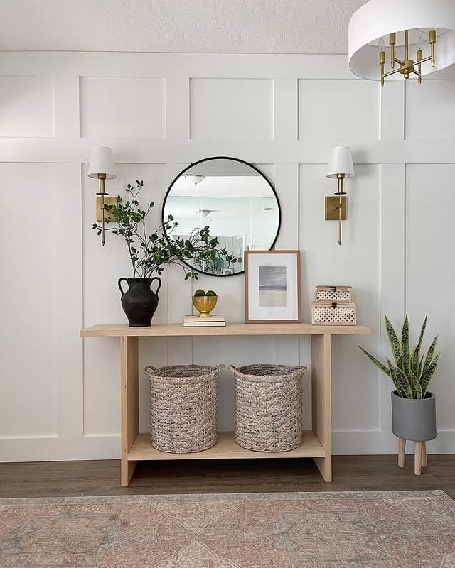 17. Soft White Paneled Console Accent Wall - accent wall ideas for living room