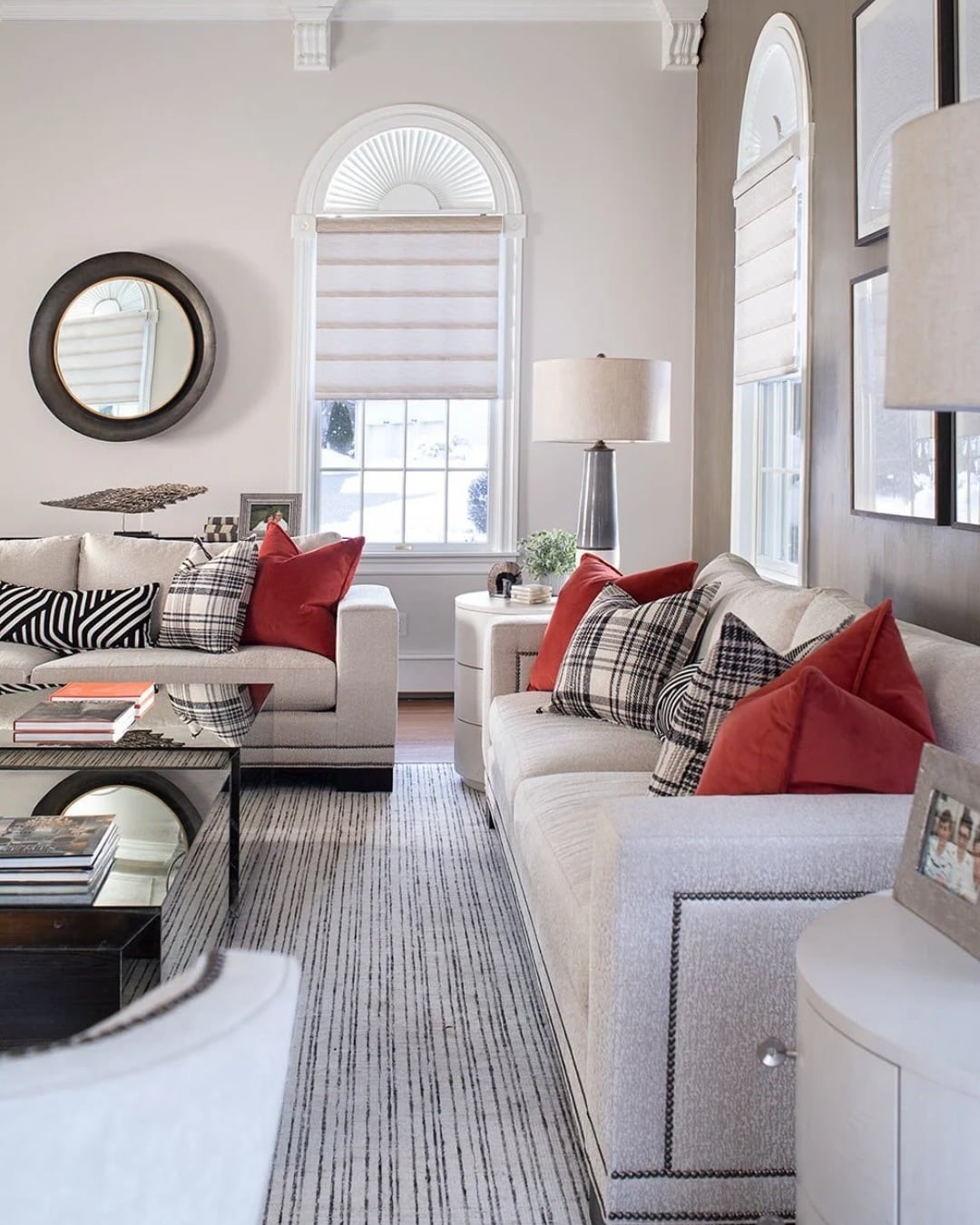 20. Soft Gray Accent Wall with Warm Red Accents - accent wall ideas for living room