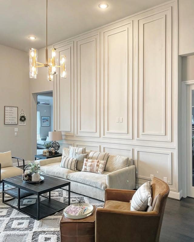 22. Tall White Panel Accent Wall with Architectural Impact - accent wall ideas for living room