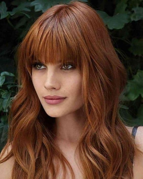 4. Textured Long Layers with Full Fringe in Copper Red - Long Layered Hairstyles with Bangs