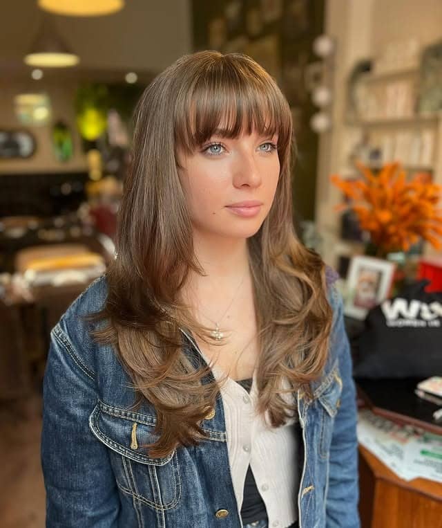 15. Long Rounded Layers with Blunt Bangs in Ashy Light Brown - Long Layered Hairstyles with Bangs