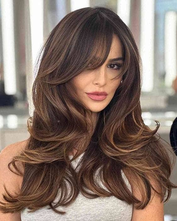 16. Glamorous Long Layers with Side Bangs in Chestnut Brown - Long Layered Hairstyles with Bangs