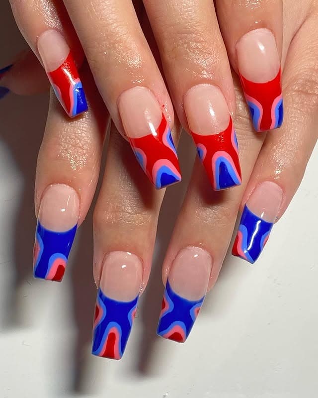2. Abstract Flame Tips in Red and Blue - red and blue nail ideas