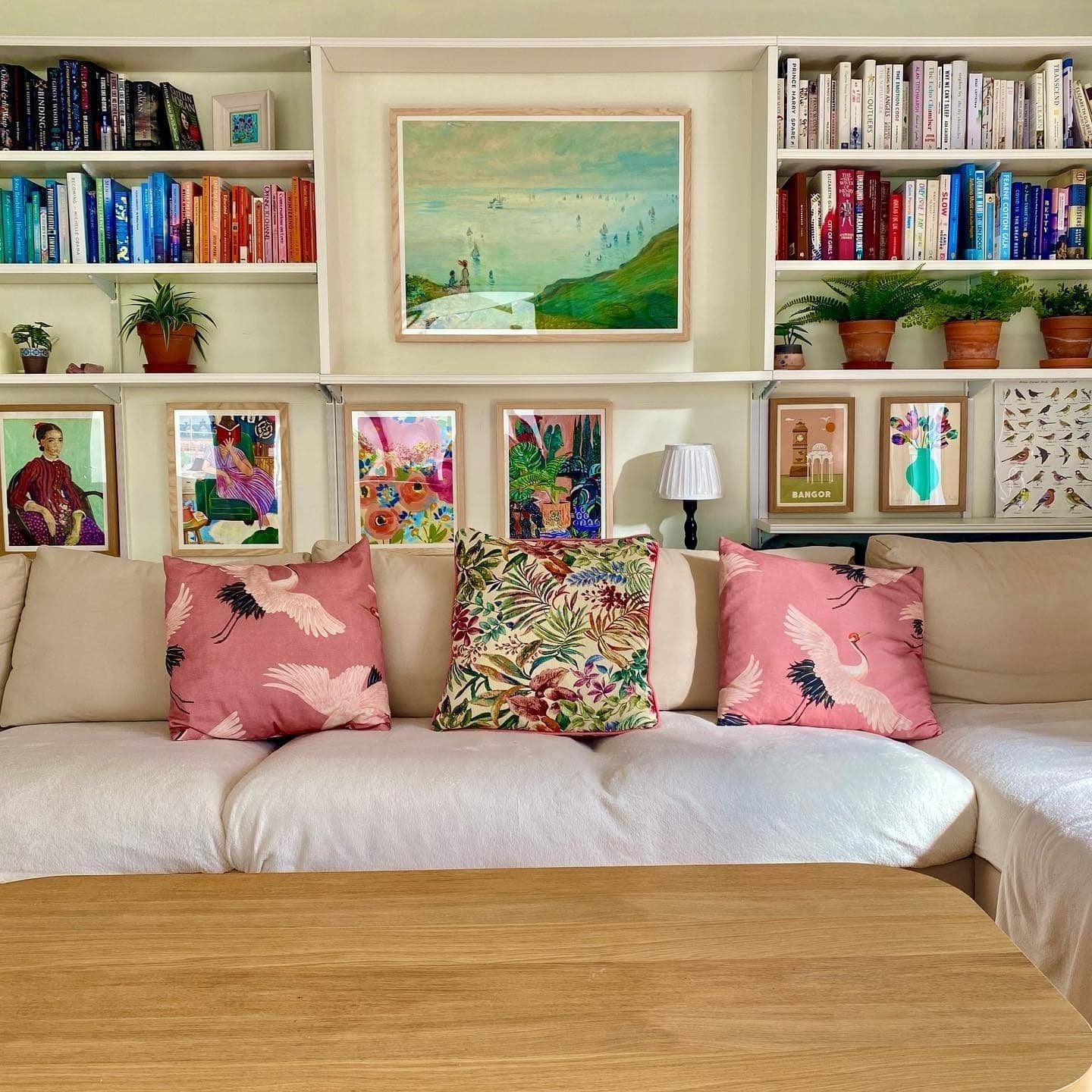 3. Color-Rich Gallery Wall with Collected Character - gallery wall living room ideas