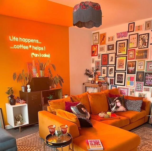 5. Eclectic Gallery Wall with Orange and Graphic Prints - gallery wall living room ideas