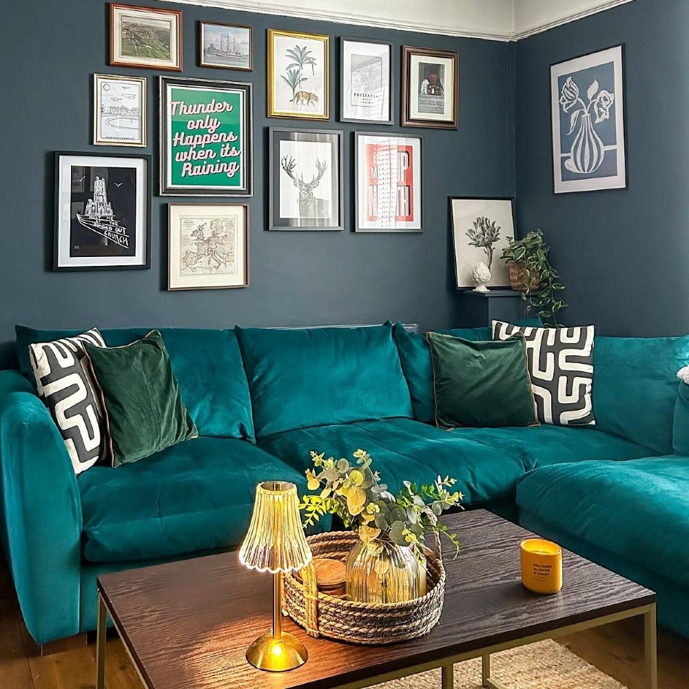 14. Teal Velvet Gallery Wall with Vintage Artwork - gallery wall living room ideas