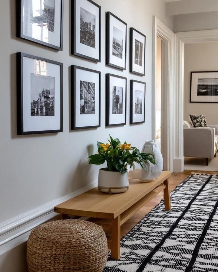 17. Hallway-Style Gallery Wall with Black and White Photography - gallery wall living room ideas