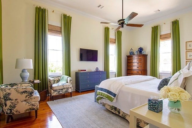 14. Traditional Bedroom with Green Drapes and Blue Furniture - blue and green bedroom ideas