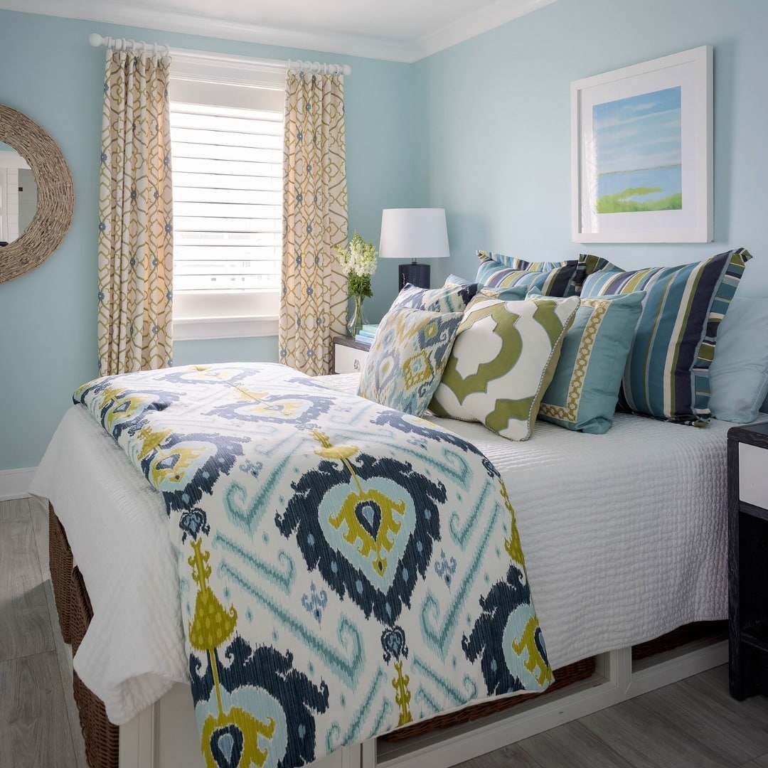 15. Light Blue Walls with Blue and Green Patterned Textiles - blue and green bedroom ideas
