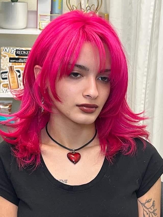 13. Neon Magenta Shag with Feathered Bangs - Magenta Hair Color