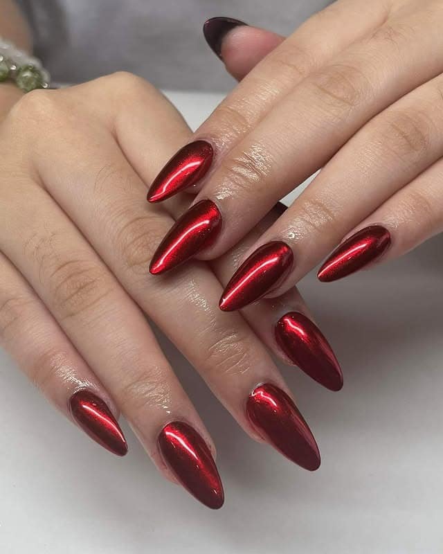 1. Ruby Chrome Stiletto Elegance - red chrome nail ideas