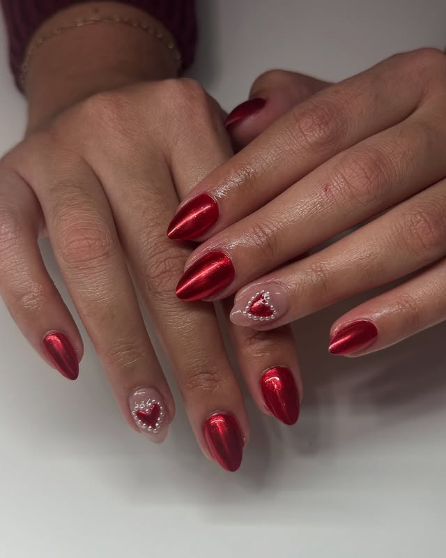 5. Red Chrome Almond with Heart Accent - red chrome nail ideas