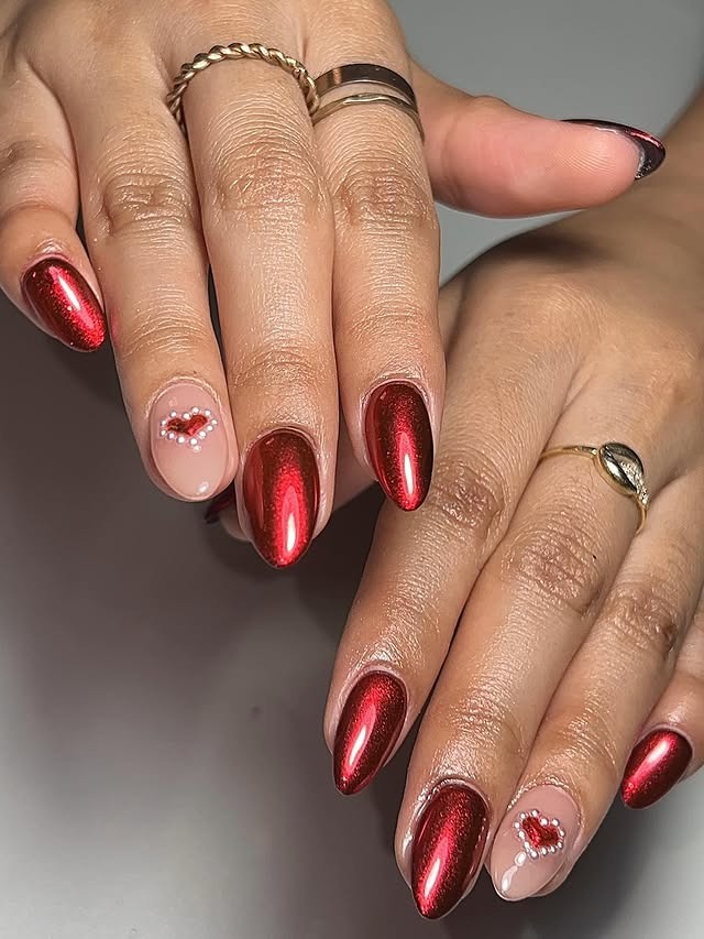 20. Red Chrome Almond with Heart Accent - red chrome nail ideas