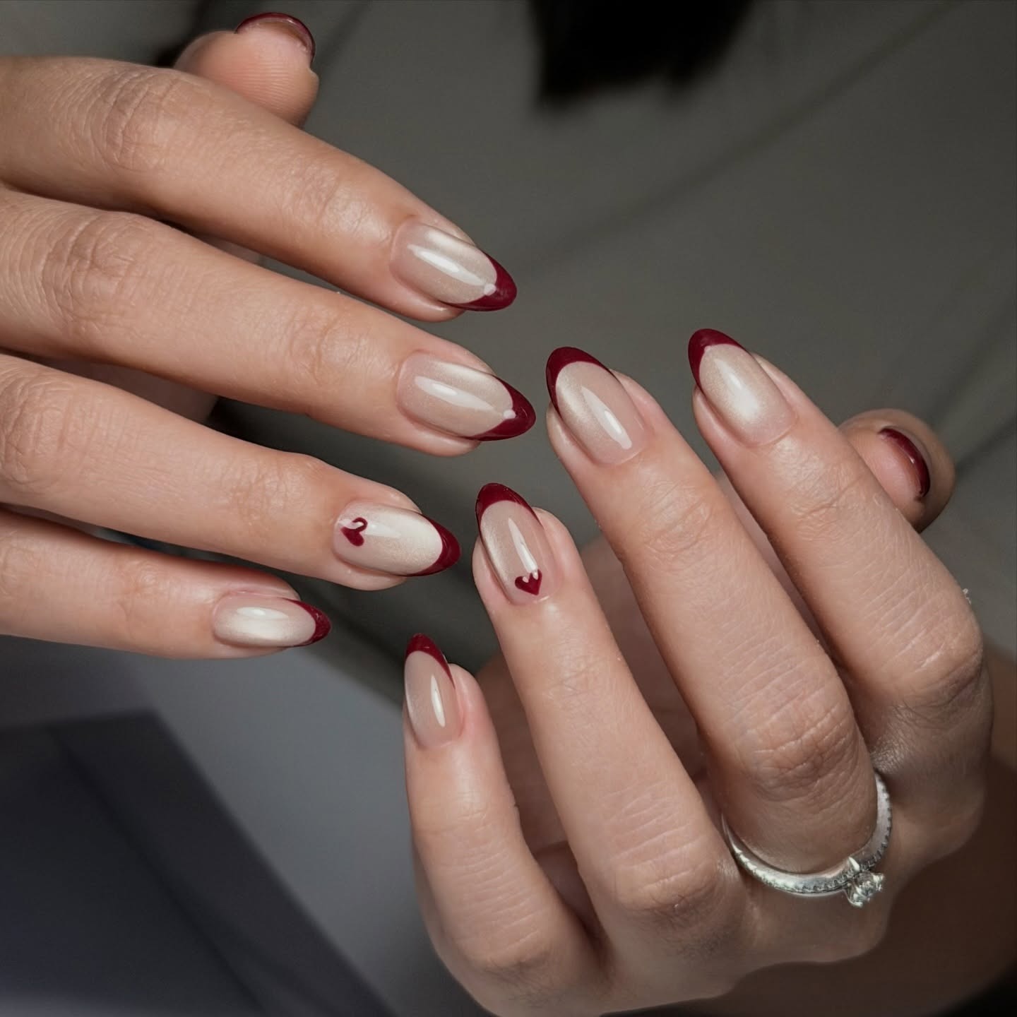 12. Almond Red French With Mini Heart Details - red french nail ideas