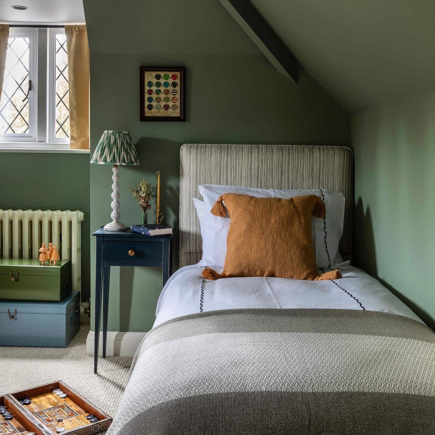 2. Cozy Attic Bedroom Idea in Olive Green and Warm Neutrals - childrens bedroom ideas