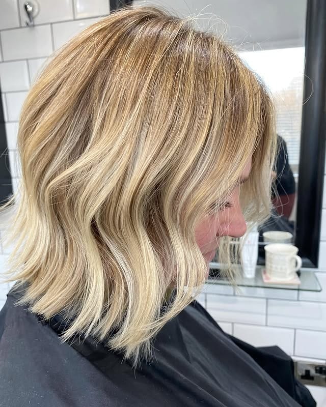 13. Sunlit Blonde Wavy Bob - Bouncy Bob Hair