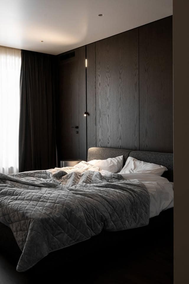 2. Minimalist Dark Wood Retreat - dark wood bedroom ideas
