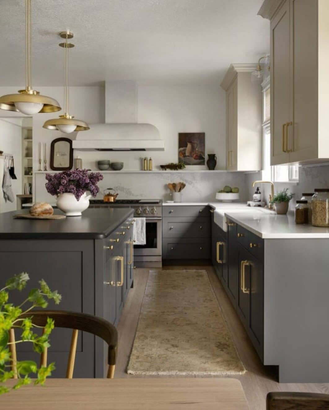 2. Moody Charcoal Cabinets with Brushed Brass Details - kitchen cabinet color ideas