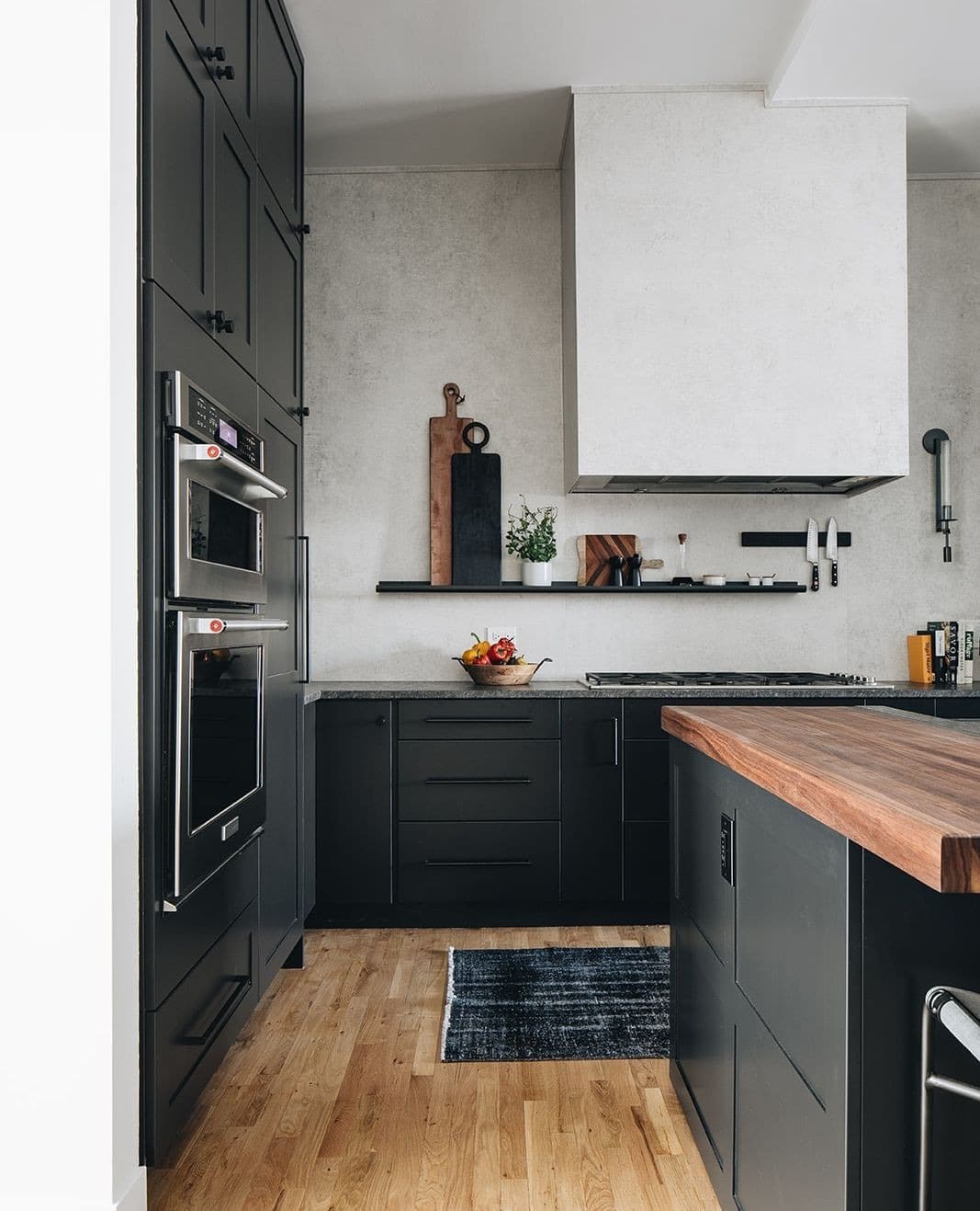 12. Matte Black Cabinets with Industrial Influence - kitchen cabinet color ideas