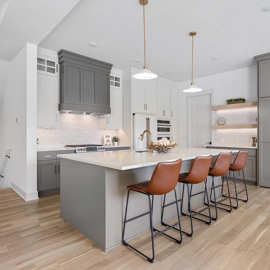 18. Two-Tone Gray and White Cabinets with Modern Scale - kitchen cabinet color ideas