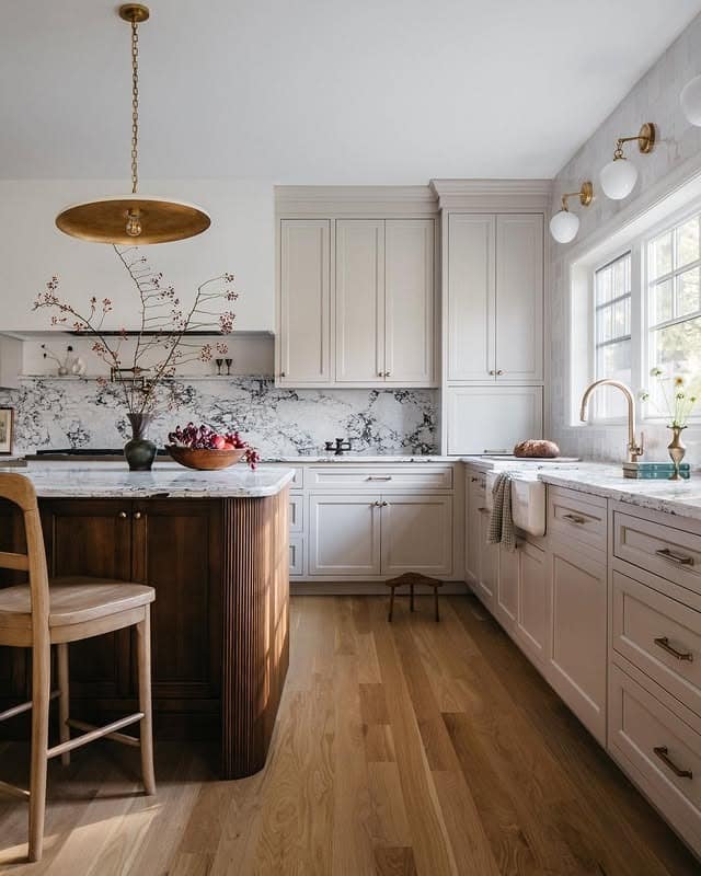 21. Soft White Cabinets with Sculpted Wood Island - kitchen cabinet color ideas