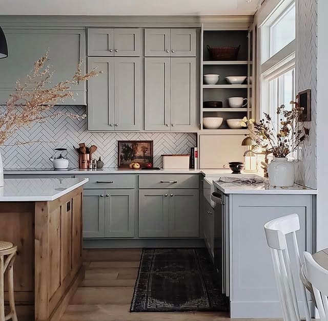 22. Muted Gray-Green Cabinets with Cozy Traditional Style - kitchen cabinet color ideas