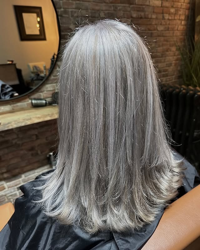 3. Feathered Ash Gray Mid-Length Cut - Gray Hair Color