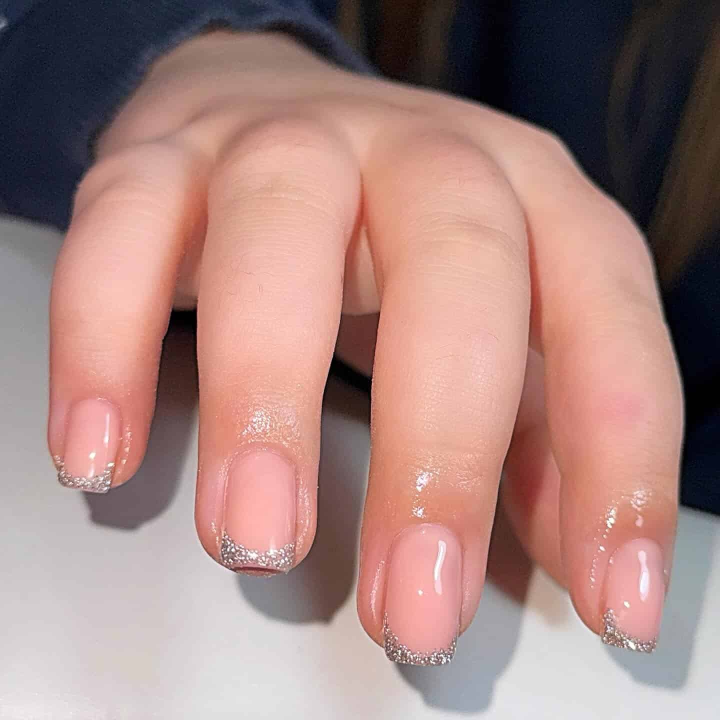 4. Short Natural Pink Nails with Silver Glitter Tips - silver glitter nail ideas