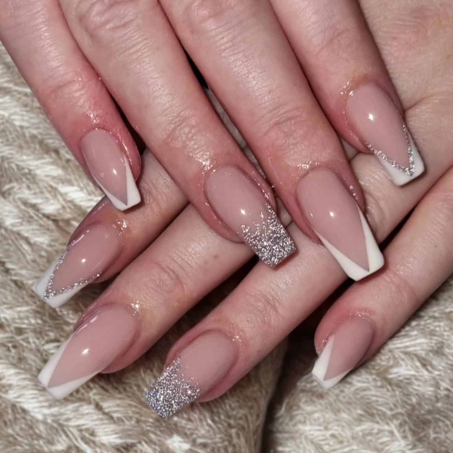 5. Nude Coffin Nails with Silver Fade Accent - silver glitter nail ideas