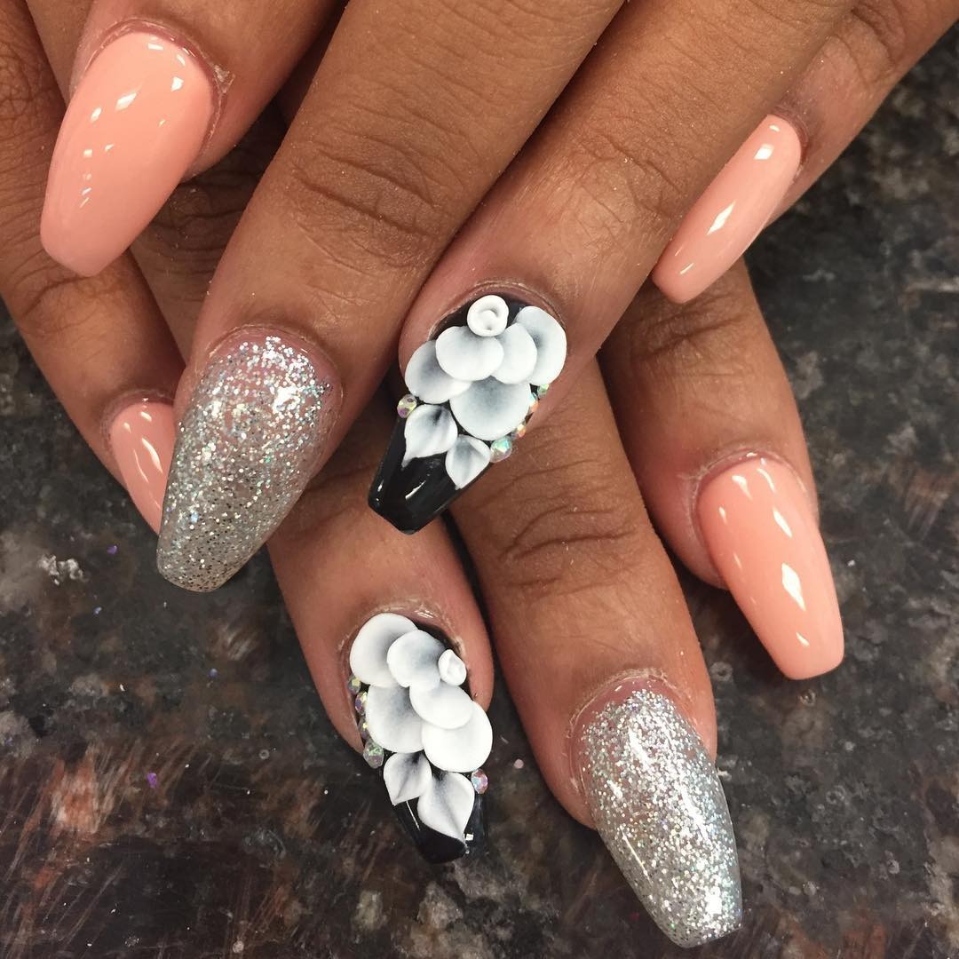 6. Sculpted Floral Accent with Silver Glitter Nails - silver glitter nail ideas