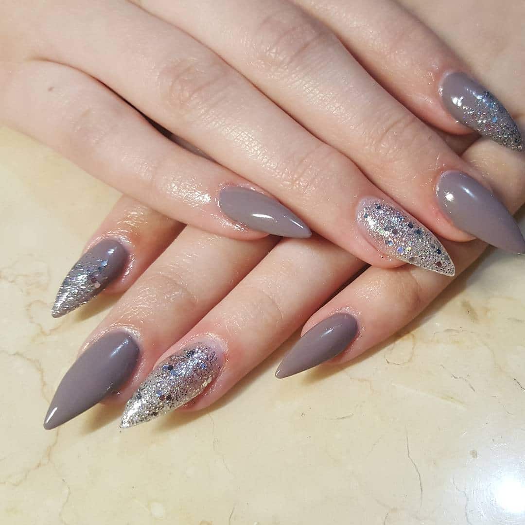 8. Matte Gray and Silver Glitter Stiletto Nails - silver glitter nail ideas