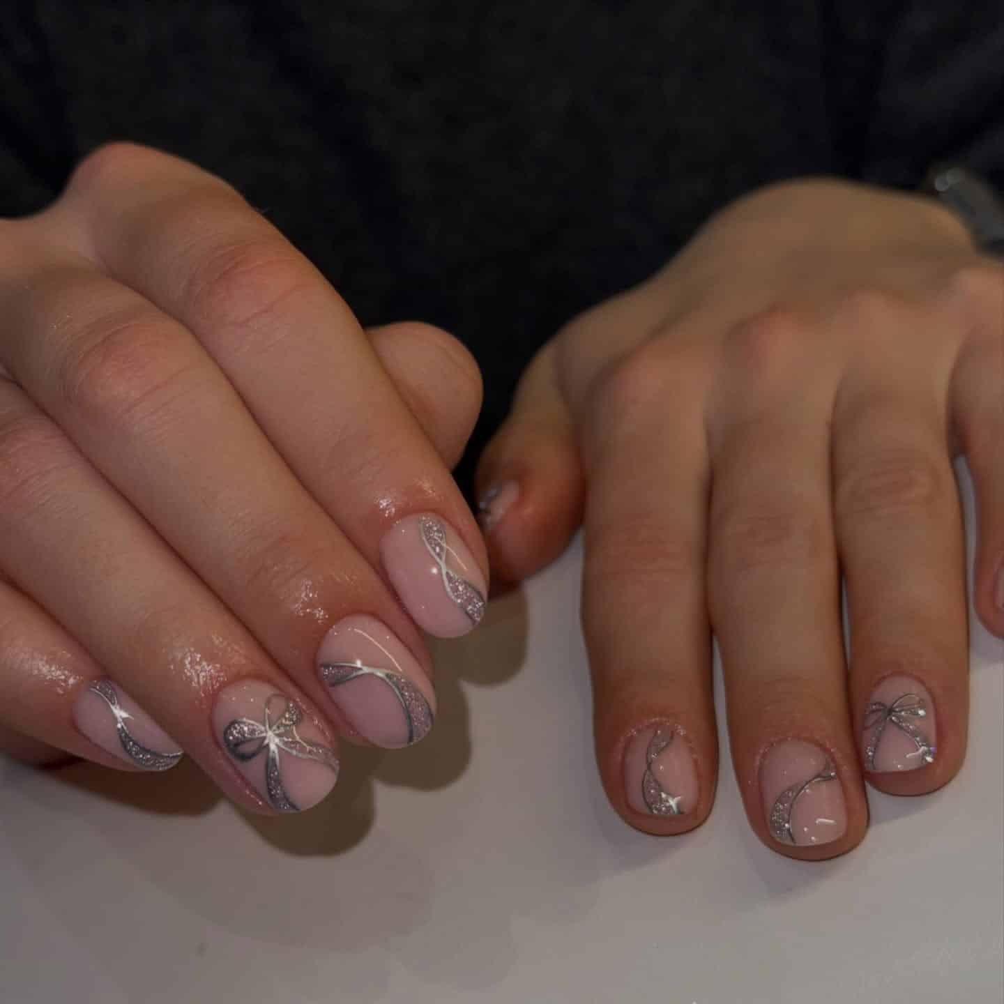 9. Soft Pink Nails with Silver Ribbon Detail - silver glitter nail ideas