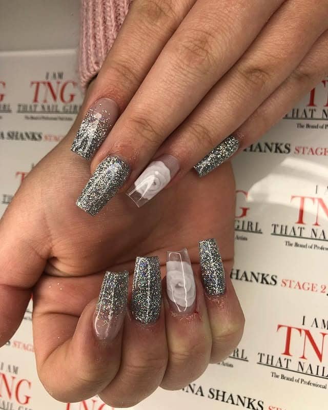 13. Silver Glitter Coffin Nails with Sculpted Art - silver glitter nail ideas