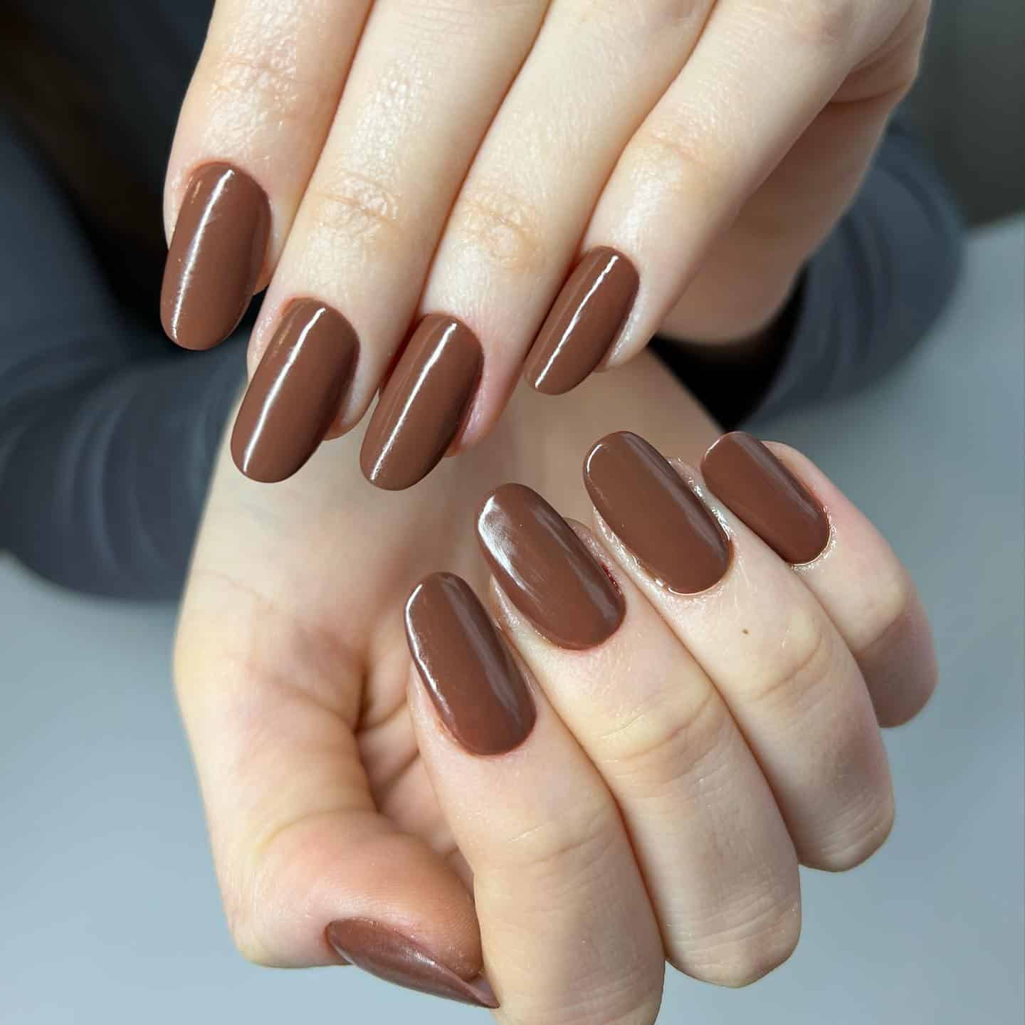 2. Chocolate Brown Short Oval Nails - simple brown nail ideas