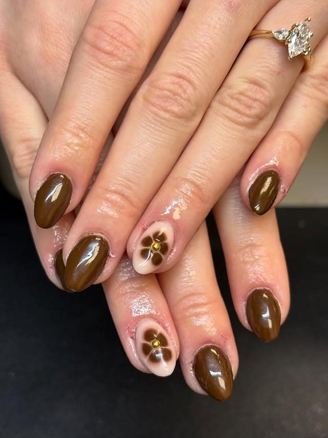 8. Deep Brown Almond Nails with Floral Accent - simple brown nail ideas