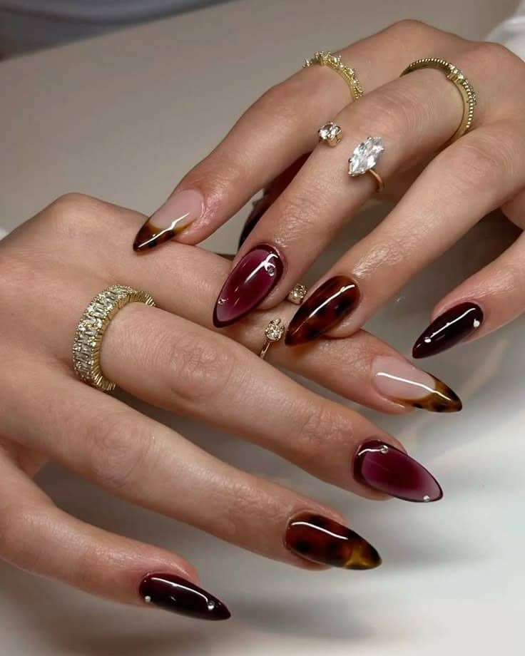 17. Brown Tortoiseshell Almond Nails - simple brown nail ideas