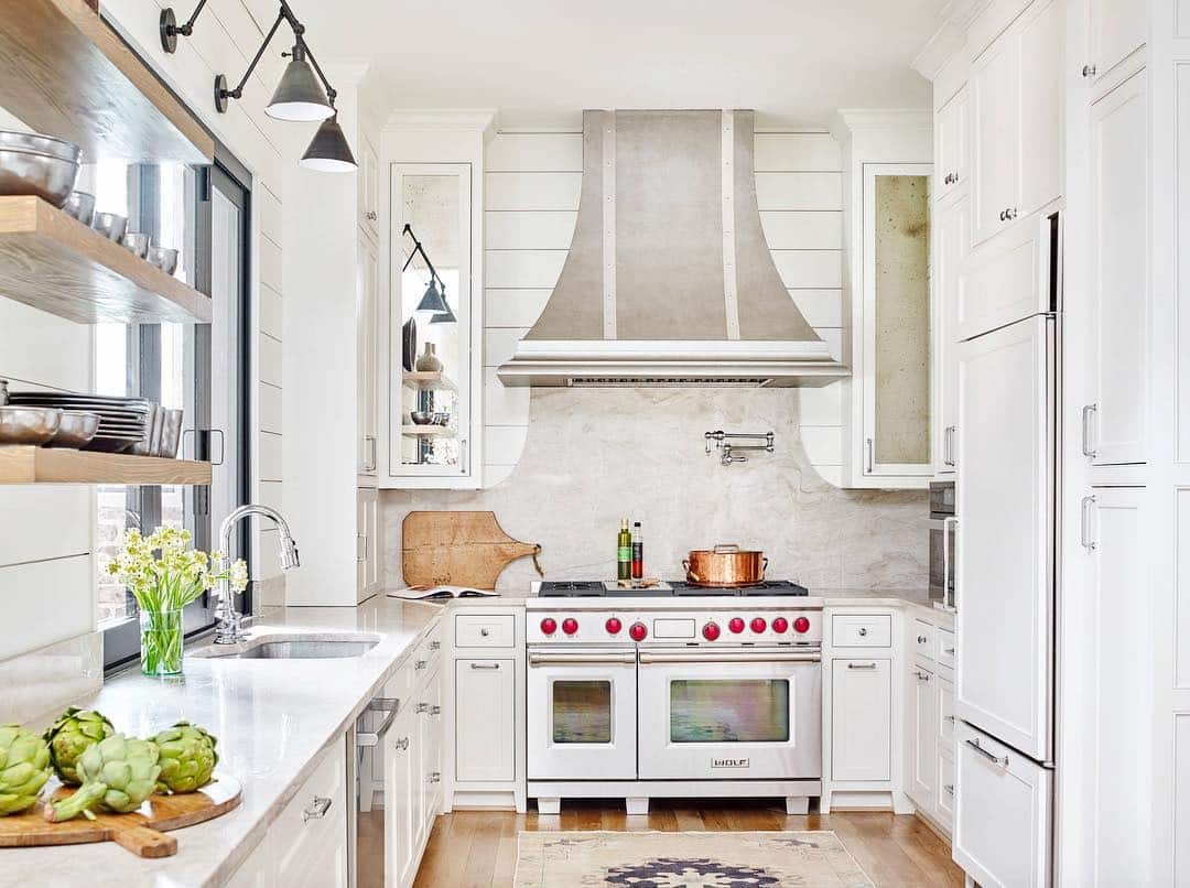 10. Cozy White Kitchen with Patterned Runner and Warm Wood Floors - small cozy kitchen ideas