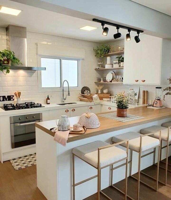 14. Modern White Kitchen with Soft Wood Island and Black Lighting - small cozy kitchen ideas