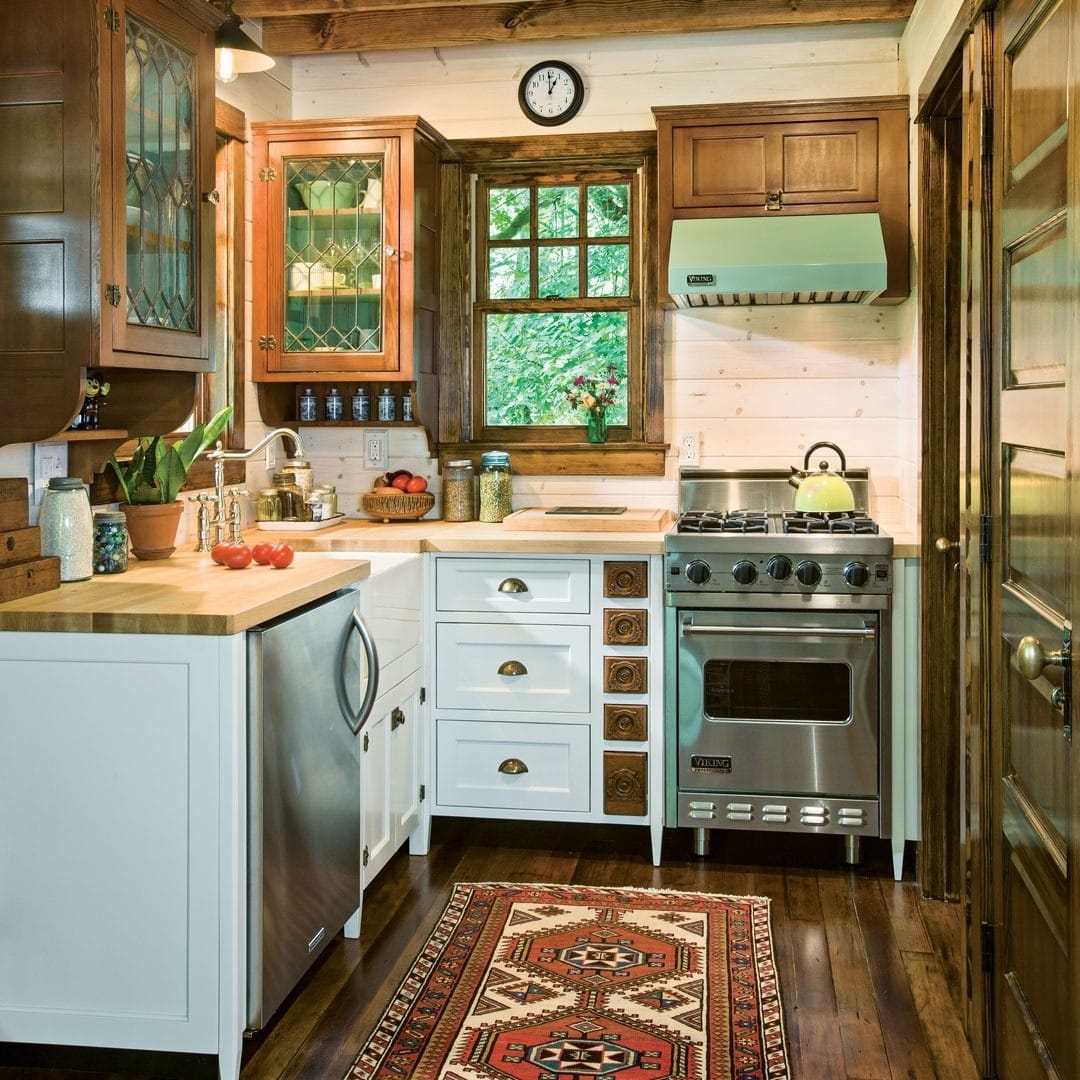 15. Cottage-Style Kitchen with White Cabinets and Natural Wood - small cozy kitchen ideas