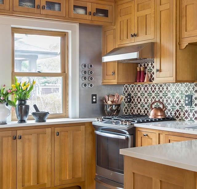 18. Contemporary Grey Kitchen with Stone and Wood Details - small cozy kitchen ideas