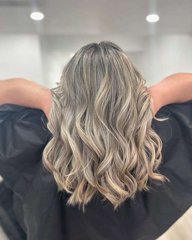 21. Cool Blonde Waves with Rooted Dimension - Blonde Hair Color