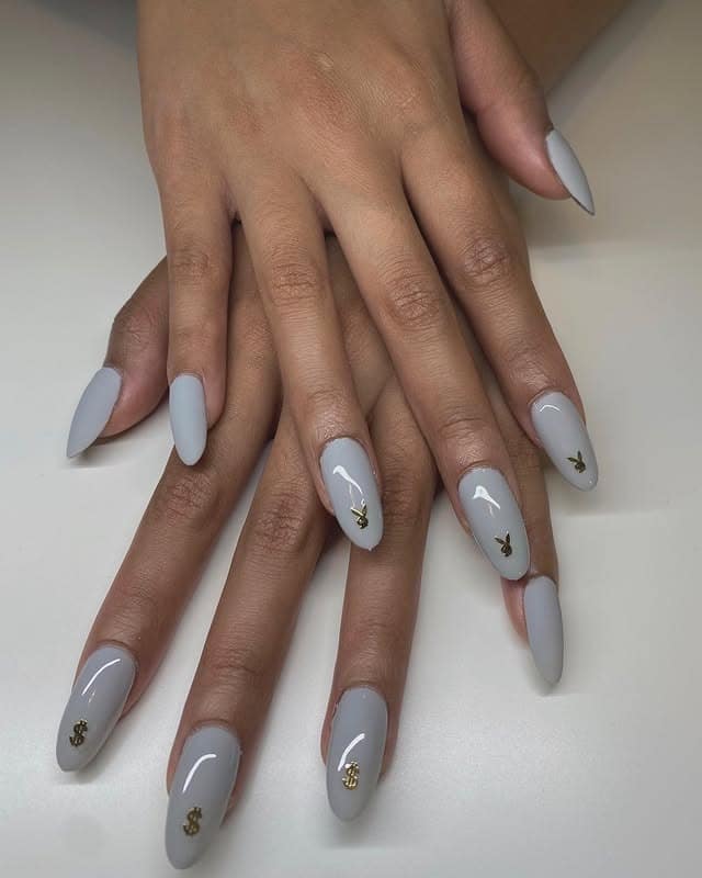 3. Cool Grey Almond Nails with Gold Charm Accents - simple grey nail ideas