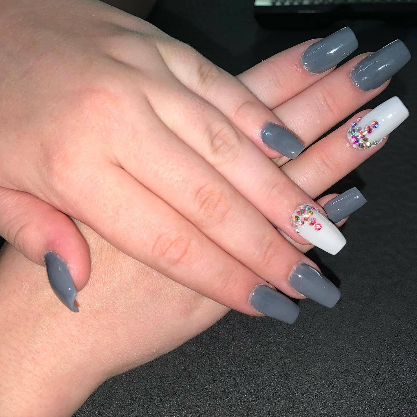 19. Dark Grey Coffin Nails with Rhinestone Accent - simple grey nail ideas